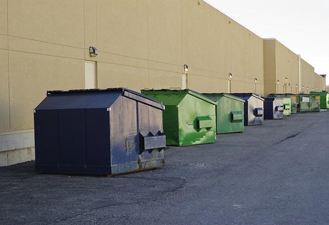 construction workers disposing of debris in large dumpsters in Carson City, NV